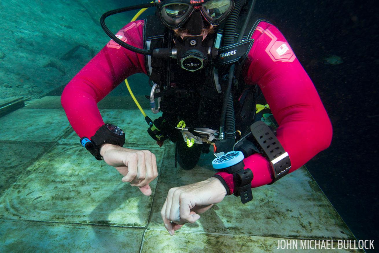 ScubaLab testing dive computers underwater at Blue Grotto
