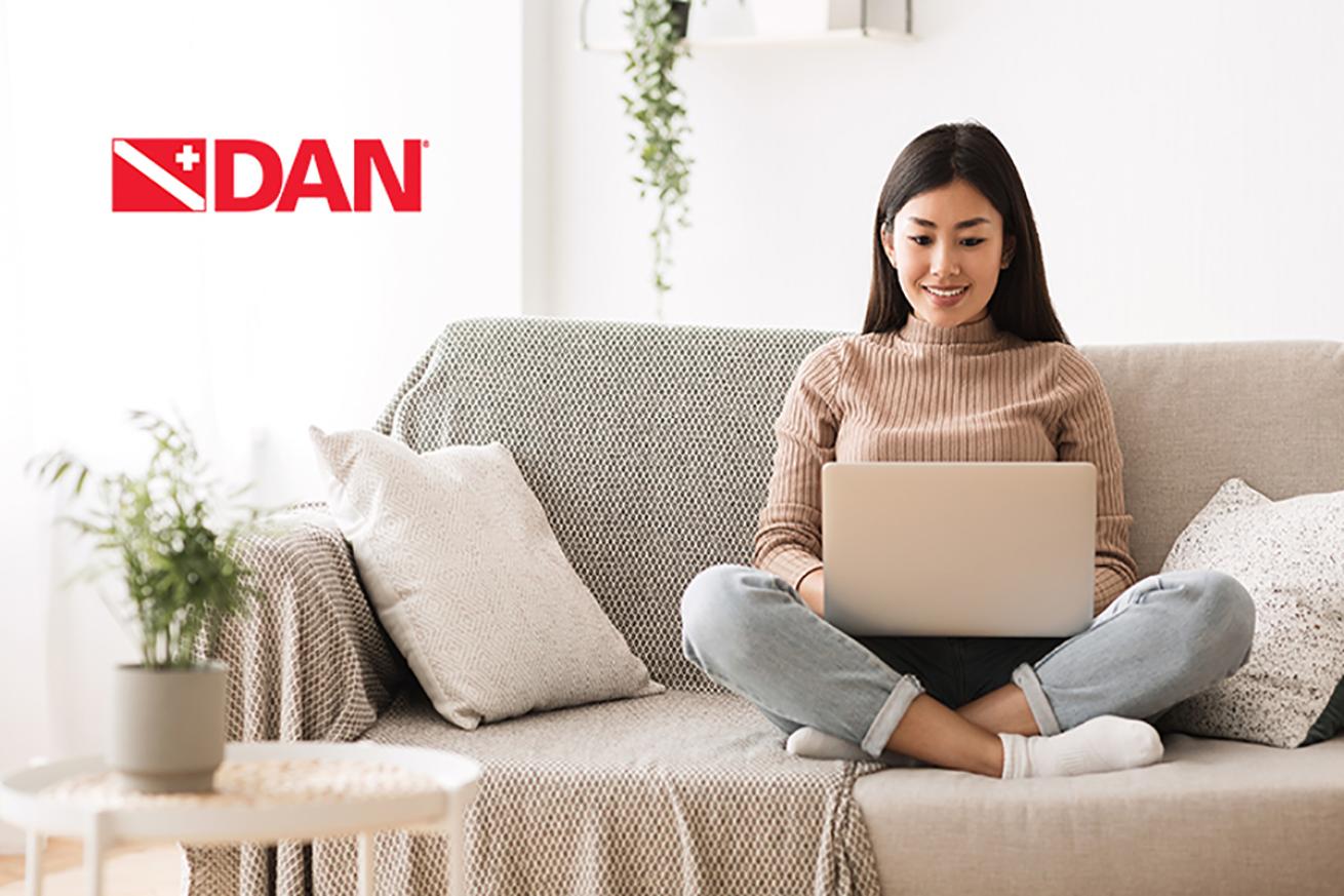 Woman works on couch
