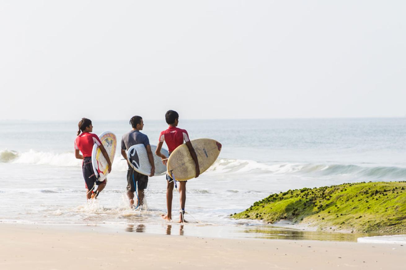 surfers on beach