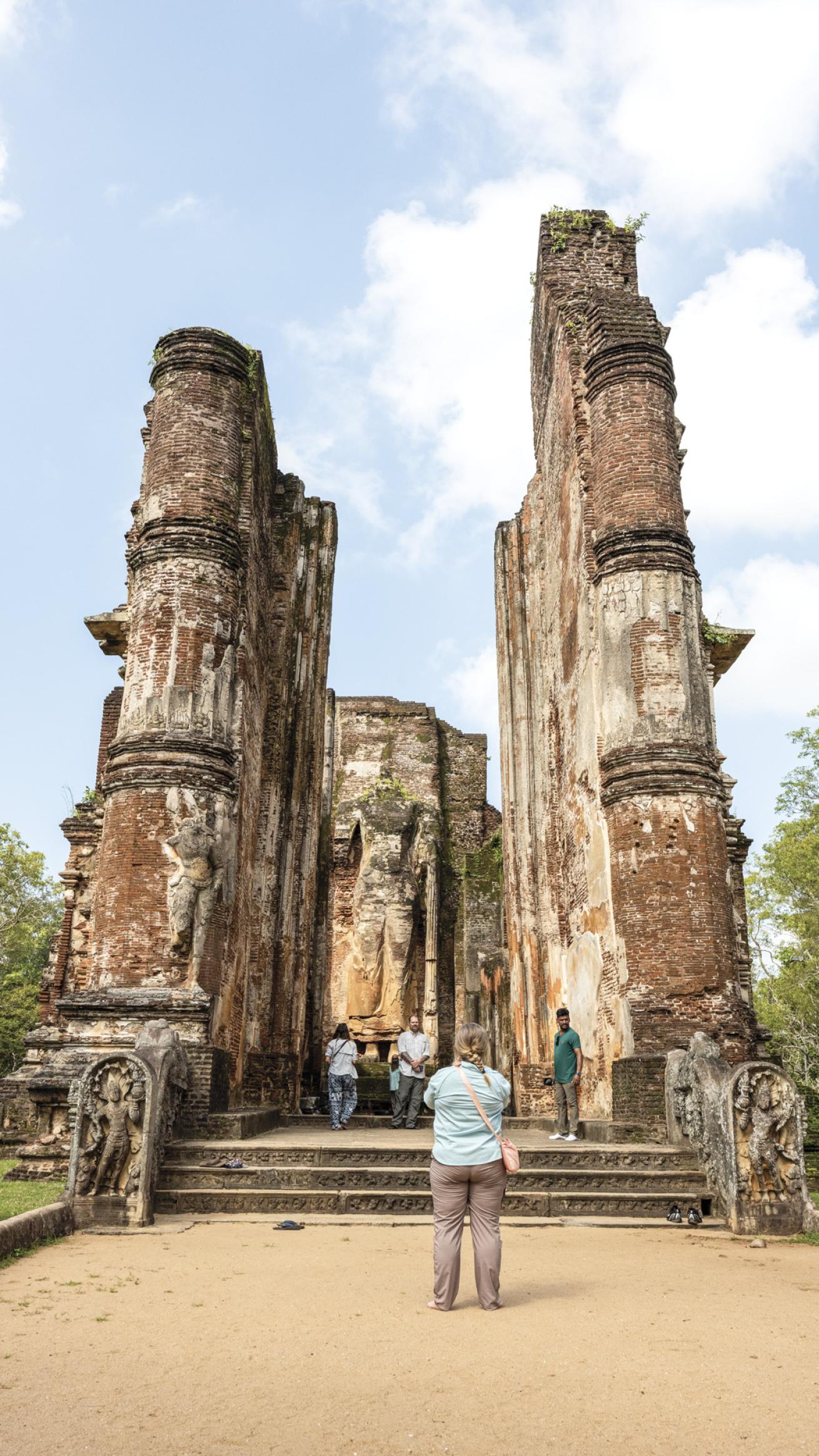 The group explores Lankatilaka Temple and the ancient city of Polonnaruwa. Intricate stone carvings make it a cultural wonder.
