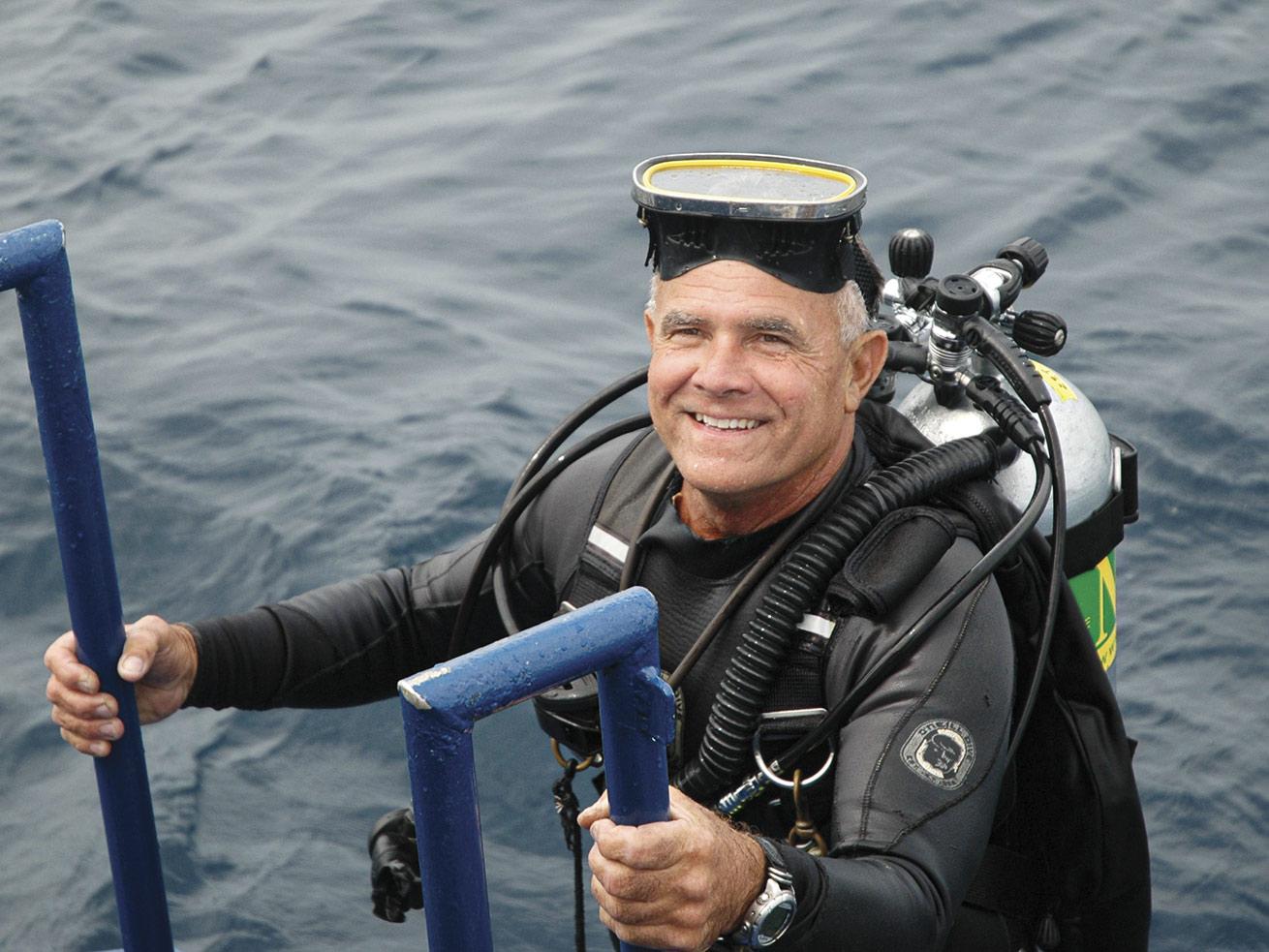 image of george purifoy in scuba gear exiting the water