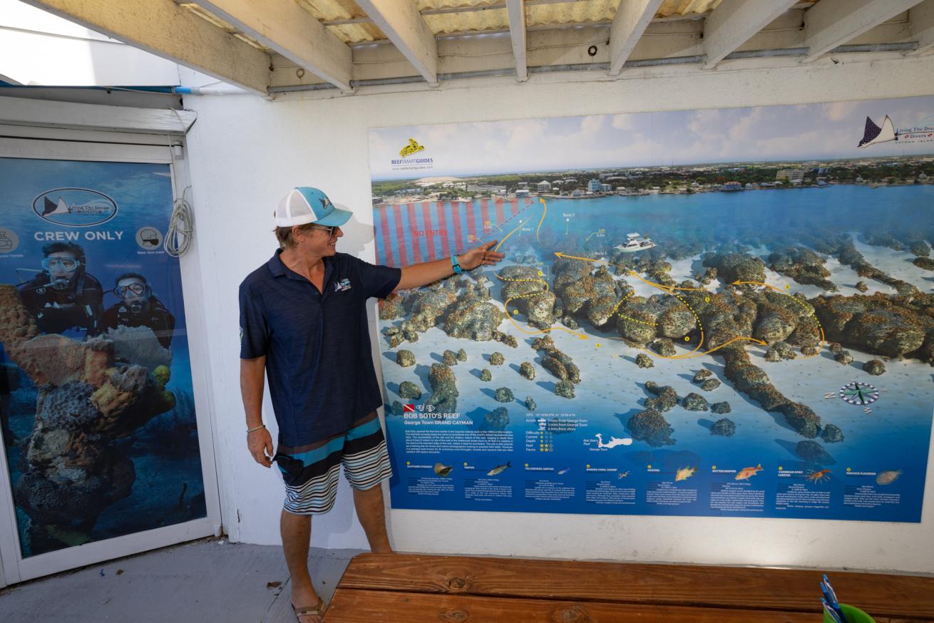 Living the Dream Divers shows clients the topography of Soto Reef, a favorite house reef on Grand Cayman.