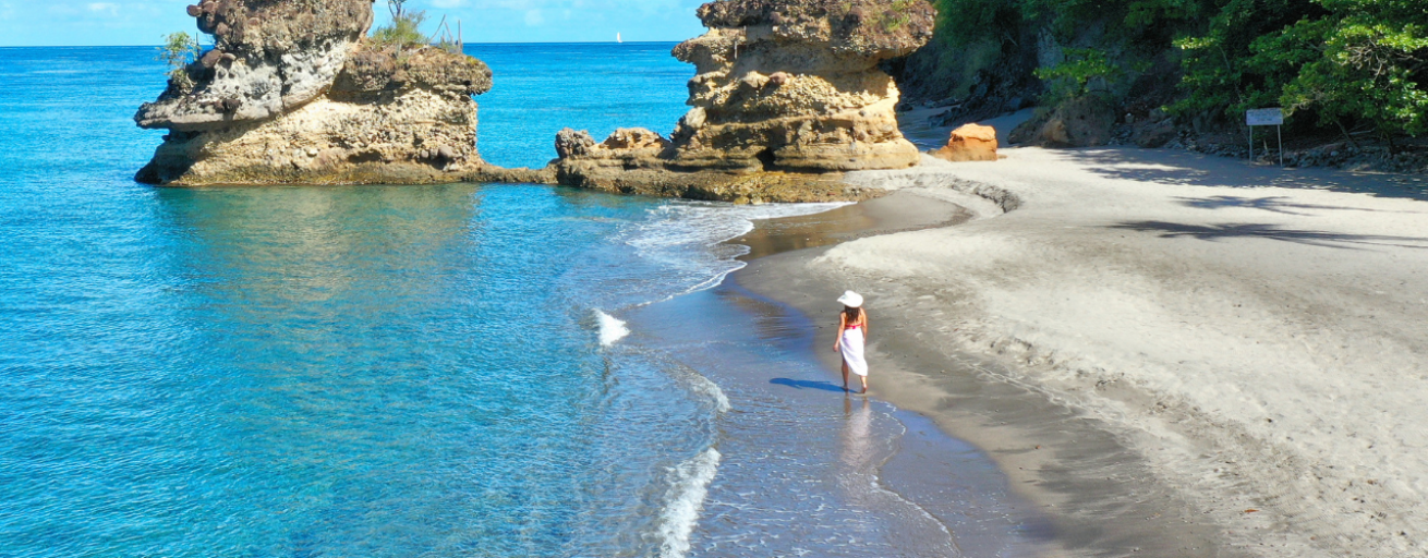 A person walking on a beach