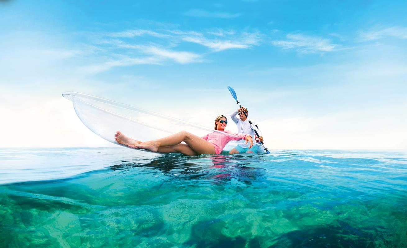 A person and person on a boat in the water