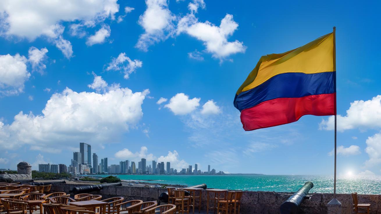 flag of colombia with cartagena in background