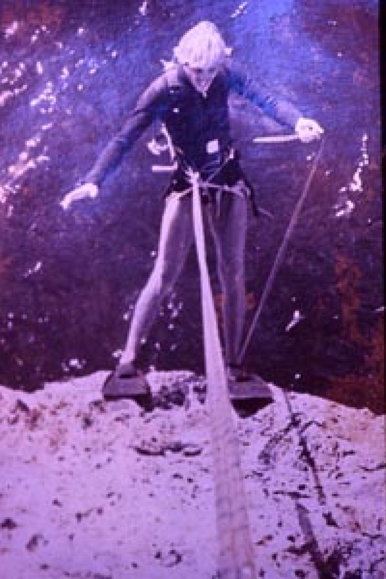 Bruce Bowker rappels down the a Bonaire cliff in search of new dive sites