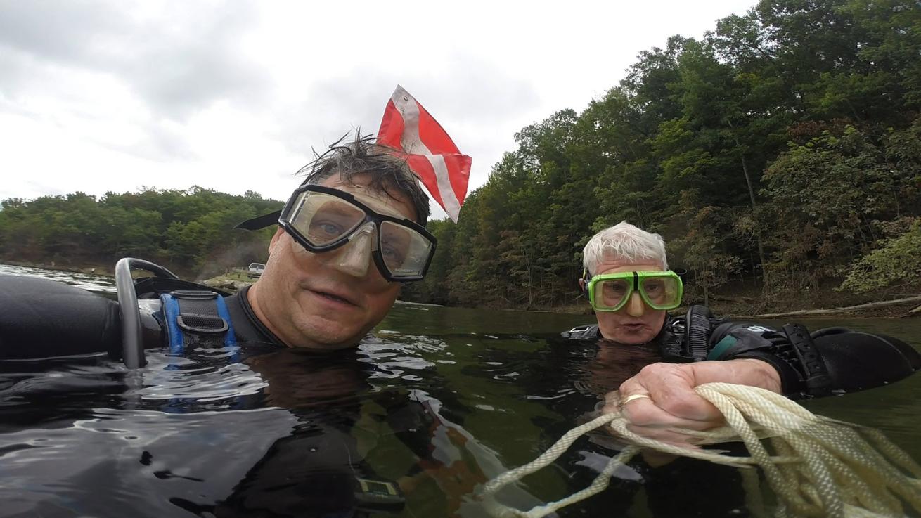 scuba divers at the surface