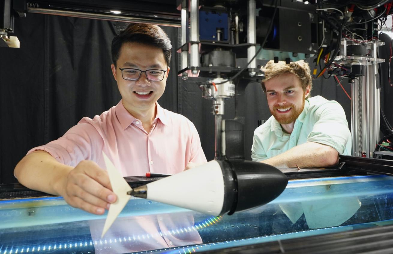 Researchers with fish-like robot