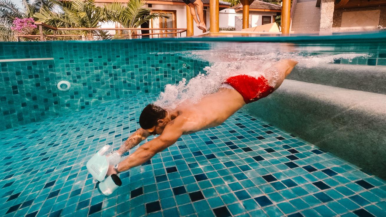A person using an underwater scooter on vacation.