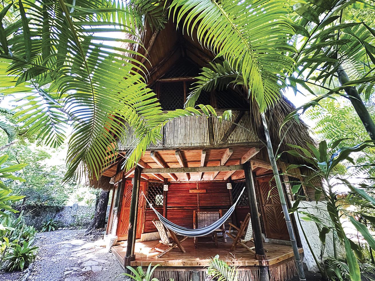 An inviting bungalow to return to after diving at Natura Cabana.
