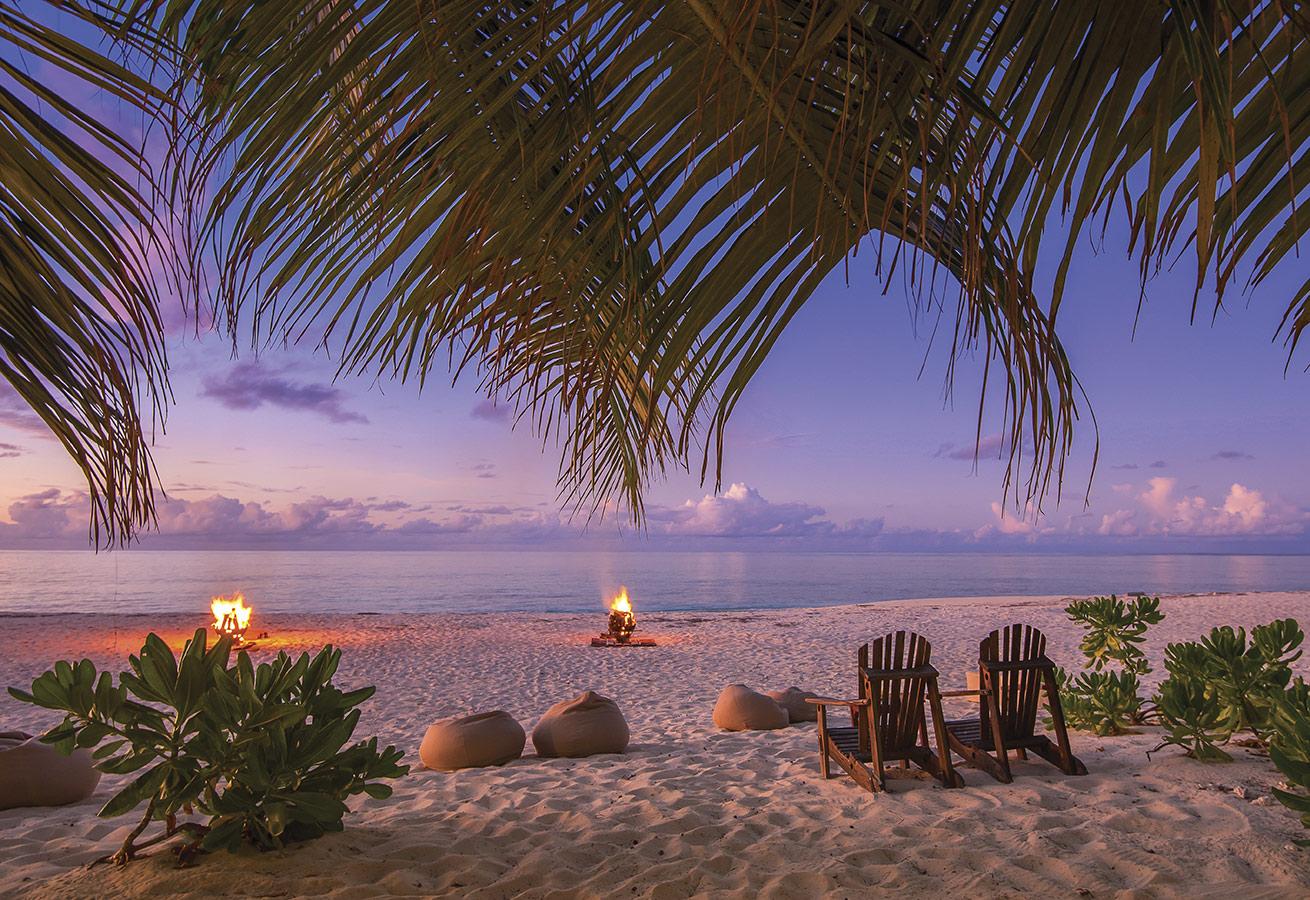 Beach bonfires set the mood before sunset