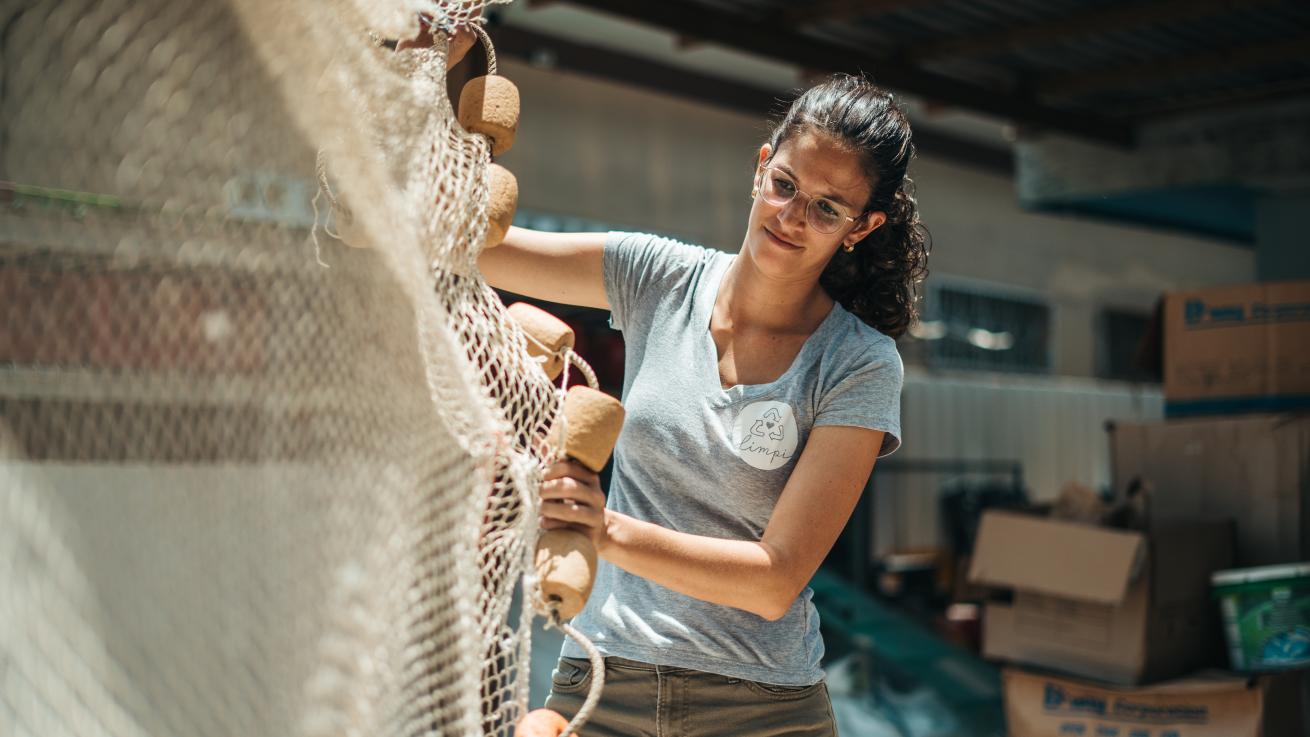 A person holding a fishing net
