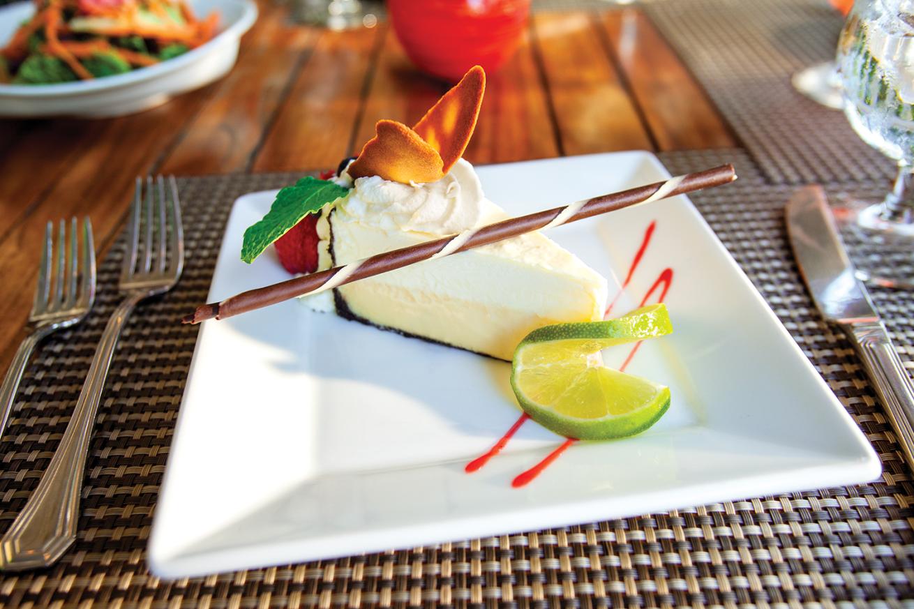 A slice of key lime pie on a plate