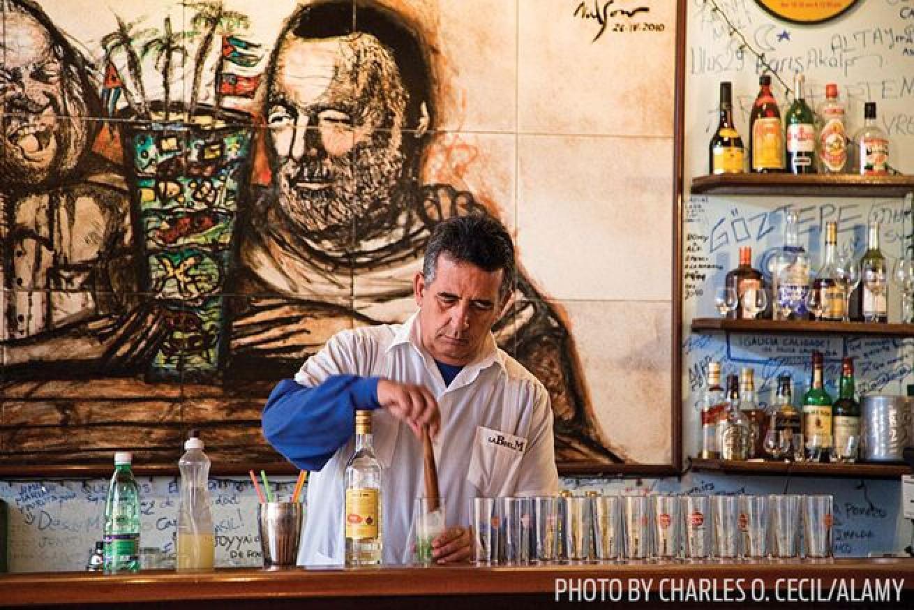 A bartender at work at La Bodeguita del Medio in Havana, Cuba