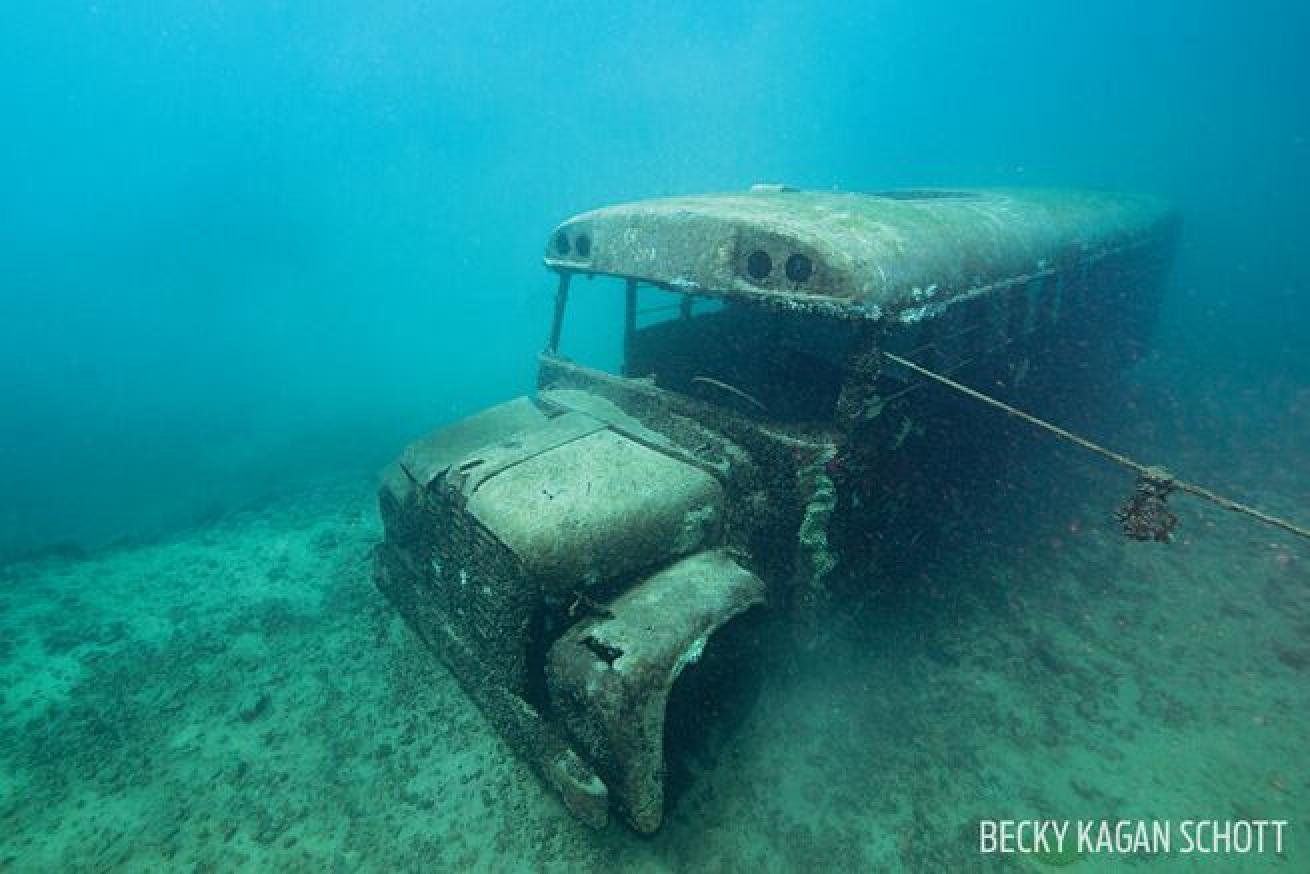 A school bus sits in 50 feet of water.