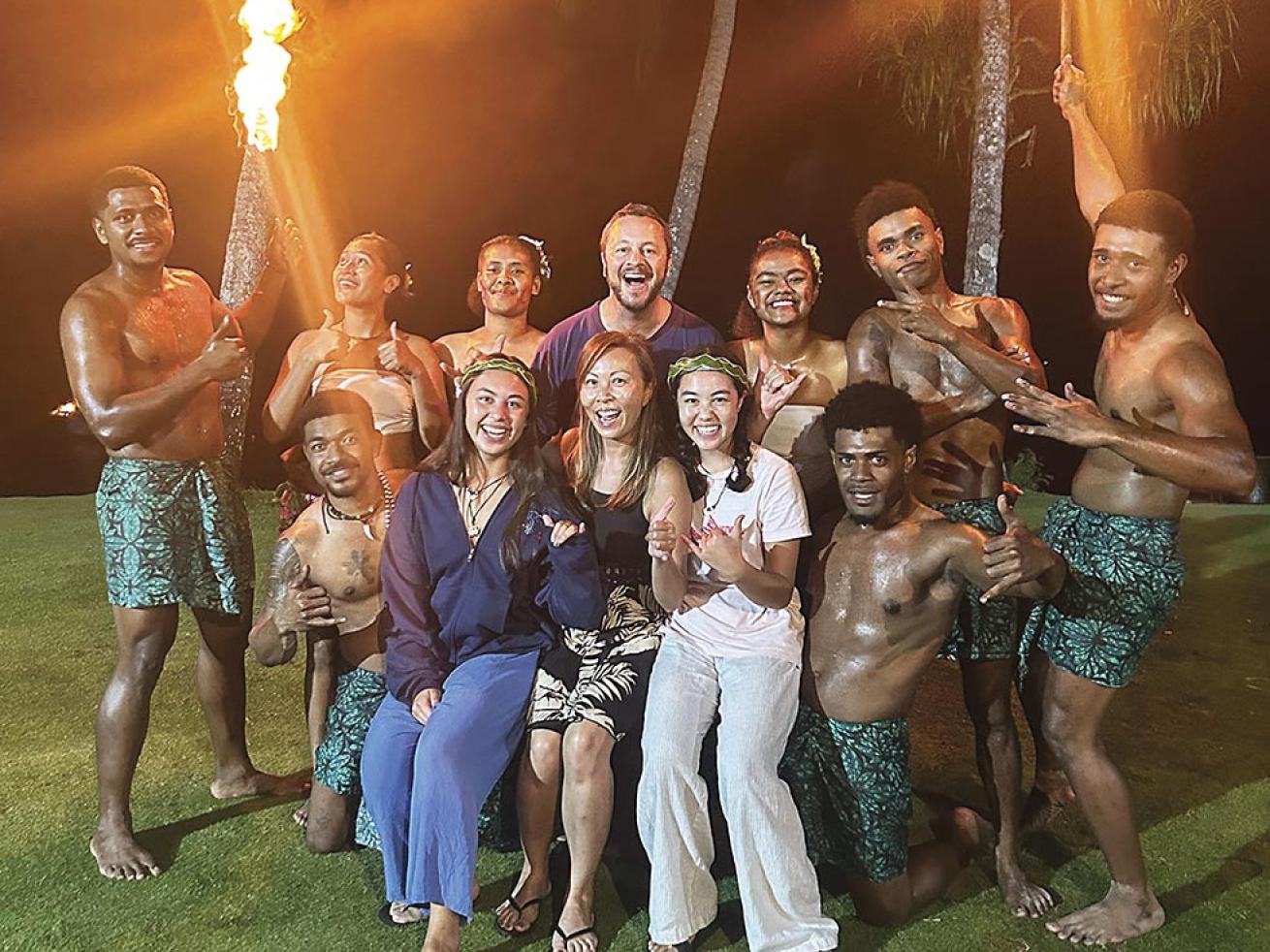 The author and his family pose with fire dancers on their final night at Beqa Lagoon Resort.
