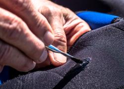 how to fix a wetsuit tear